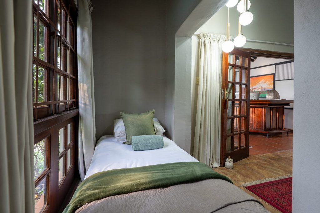 Additional single bed beside the cottage stoep at 91Waverley Guesthouse, Bloemfontein