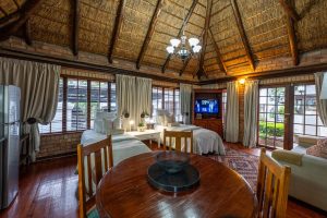 Cottage dining table and living area at 91Waverley Guesthouse, Bloemfontein