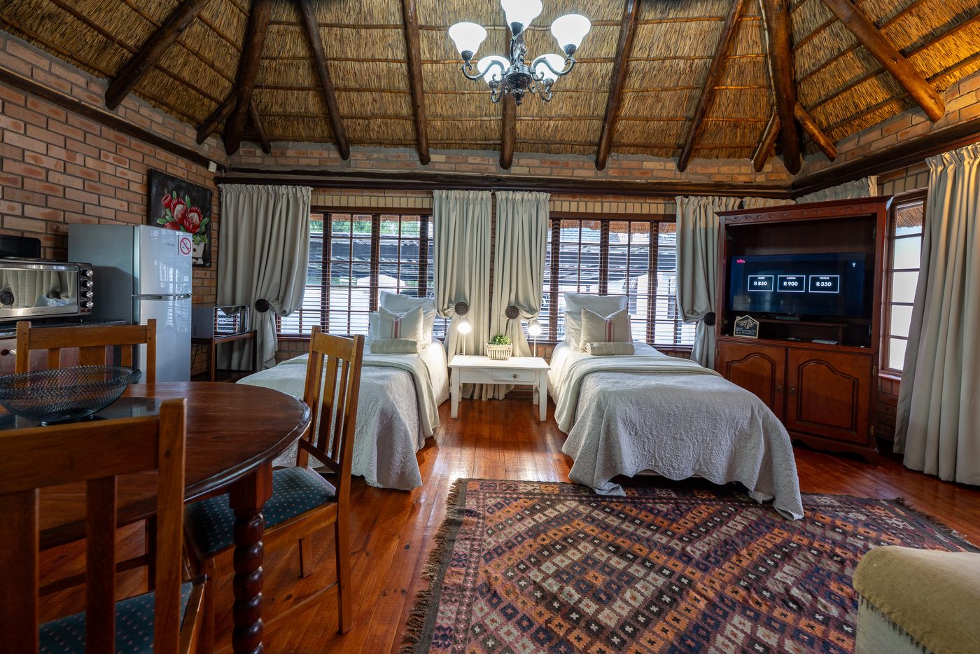 Cottage living area with two single beds at 91Waverley Guesthouse, Bloemfontein