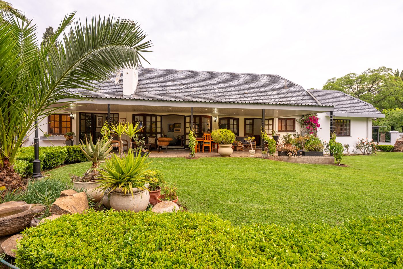 Guesthouse veranda overlooking the lawn at 91Waverley Guesthouse, Bloemfontein