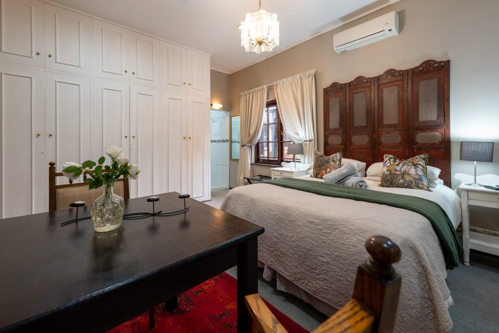 Guest room bed, seating and refreshment area at 91Waverley Guesthouse, Bloemfontein
